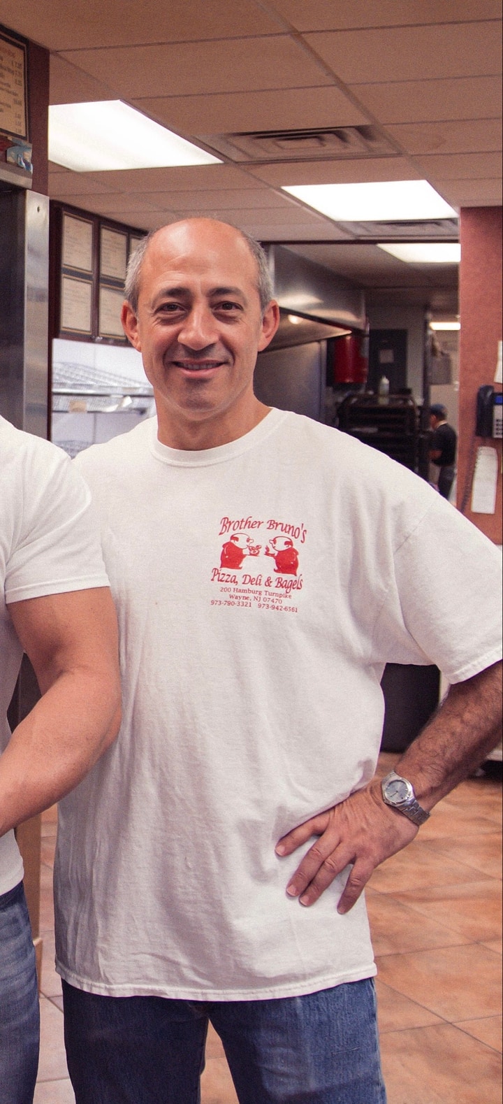 Vincenzo Mazzella smiling at the family pizzeria