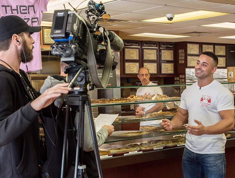 Pietro and his father behind the counter at Brother Bruno Pizza