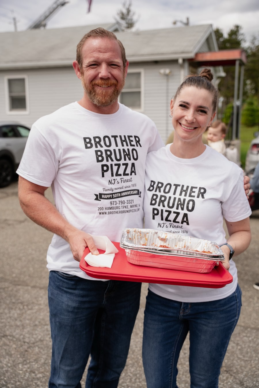 Brad and Caileen Walker together in Brother Bruno Pizza shirts